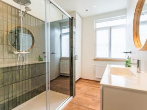 a bathroom with a shower and a sink at Holiday Home Lili's with terrace by Interhome in Blankenberge