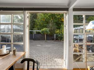 an open door with a view of a patio at Holiday Home Ranka - 300m from the sea by Interhome in Strøby Ladeplads