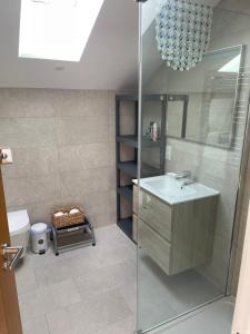 a bathroom with a sink and a shower at Ten Admiralty Pier in Shotley Gate +52 photos