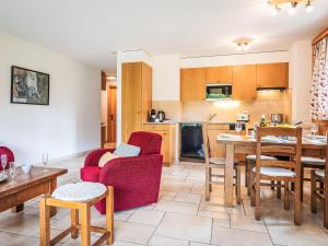 a kitchen and living room with a table and chairs at Apartment Rhodos A R03 by Interhome in Ovronnaz
