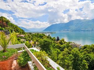 a view of the lake from a balcony at Apartment Lakeview App 501 by Interhome in Moscia