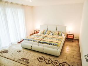 Katil atau katil-katil dalam bilik di Apartment Hegglistrasse 9-3 by Interhome