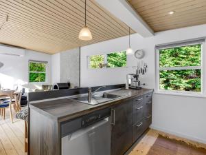 a kitchen with a sink and a counter at Holiday Home Cornel - 300m from the sea by Interhome in Strøby Ladeplads