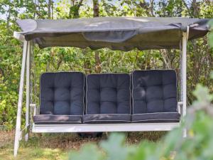 two chairs sitting under a gazebo at Holiday Home Baarde - 1-2km from the sea by Interhome in Vejby