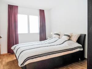 Ένα ή περισσότερα κρεβάτια σε δωμάτιο στο Apartment A11 by Interhome