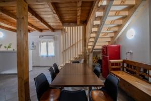 a room with a table and chairs and a red refrigerator at Casa Mario in La Giustiniana +30 photos