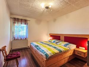 Un ou plusieurs lits dans un hébergement de l'établissement Apartment Mittagskogel by Interhome