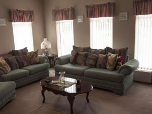 a living room with two couches and a coffee table at Holiday Home Eagle View Holiday Home by Interhome in Moone