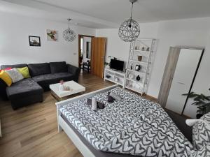 a living room with a couch and a table at Villa Dacha in Niederwurschnitz