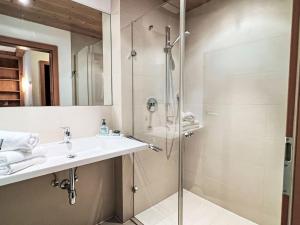 a bathroom with a sink and a shower at Apartment Cheeky Apartment-1 by Interhome in Oberndorf in Tirol