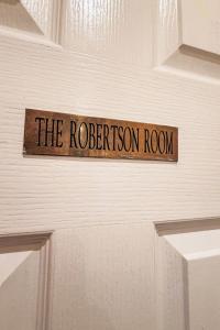 a sign that reads the roberton room on a door at Studio Room 26 by Interhome in Nairn