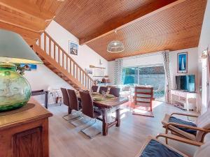 a dining room with a table and chairs at Holiday Home Les Floriales by Interhome in Vaux-sur-Mer