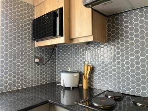 Kuchyň nebo kuchyňský kout v ubytování Beauty Blender Homes - The Brown House + 2 fotografie