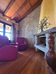 a living room with a couch and a fireplace at Tu Capricho in Piedralaves