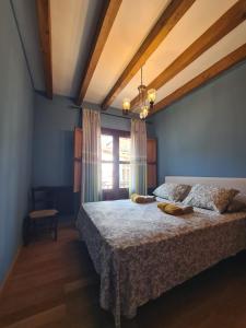 a bedroom with a bed and a window at Tu Capricho in Piedralaves +12 photos