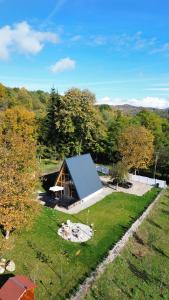 an overhead view of a house in a field at Cabana Zeneris in Vulcana de Sus