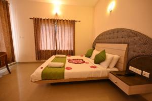 Postel nebo postele na pokoji v ubytování Cloud Dale Resort Munnar