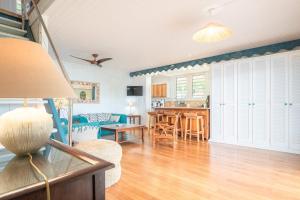a living room with a dining room and a kitchen at Villa Secrète du Pain de Sucre in Terre-de-Haut +22 photos