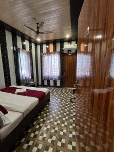 a bedroom with a bed and a shower in it at Priyakant palace in Chhatikara