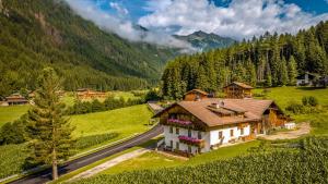 an aerial view of a house in the mountains at Wieserhof Vals in Valles