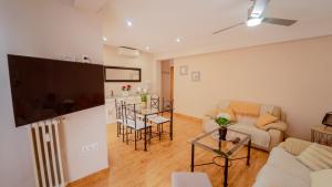 a living room with a large flat screen tv at DreamStay - San Vicente Ferrer Apartamento in Granada