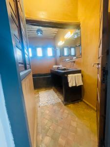a bathroom with a sink and a mirror at Riad Narjiss in Rabat