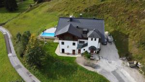 an aerial view of a house on a hill at FamilienAppartement Waldstüberl in Kleinarl