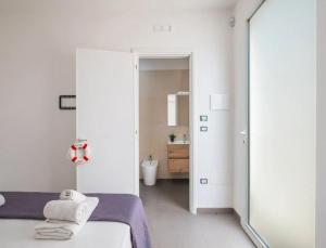 Una cama o camas en una habitación de Suite Luminosa Charme e Relax a Porto Cesareo