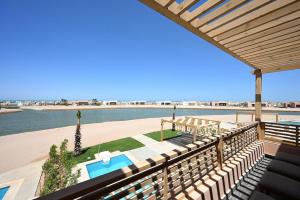 a view of the beach from the deck of a house at Stunning 3 bd penthouse with private pool - El Gouna in El Gouna