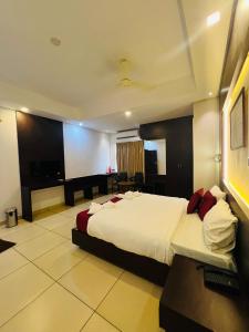 a bedroom with a large bed in a room at Luxebay in Bangalore +5 photos