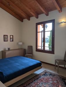 Voodi või voodid majutusasutuse Garda Resort Village 9 toas