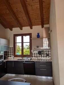 Kuchyň nebo kuchyňský kout v ubytování Casa Lolla Garda Resort Village