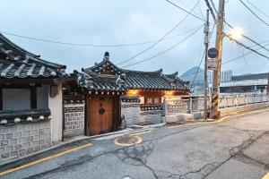 a building on the side of a street at Luxury Hanok Cottage Nest in Seoul