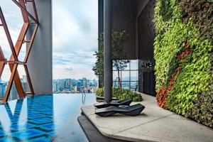 a view of a building with a swimming pool at Scarletz Service Suites KLCC in Kuala Lumpur