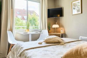 Ένα ή περισσότερα κρεβάτια σε δωμάτιο στο Cozy studio, Vauban in Lille