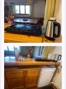 a kitchen counter with a coffee maker on top of it at Casa nel Bosco in Trento +5 photos