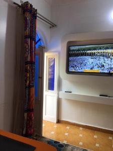 a room with a flat screen tv on a wall at Gana kato in Aswan +22 photos