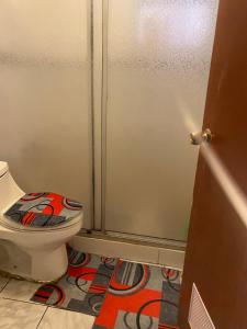 a bathroom with a toilet and a shower stall at House in Molina in Molina