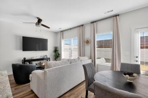 a living room with a couch and a table at Discovery Haven townhouse in Monrovia