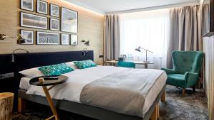 Ένα ή περισσότερα κρεβάτια σε δωμάτιο στο B&B HOTEL Tomaszów Lubelski +17 φωτογραφίες