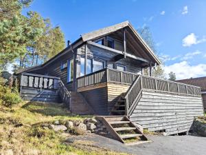 a house with a staircase leading up to it at Holiday Home Kosestua by Interhome in Madland