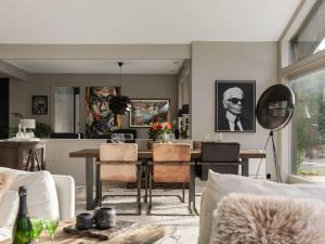 a living room with a table and chairs at Villa Frösakull Paradiset by Interhome in Frösakull +19 photos