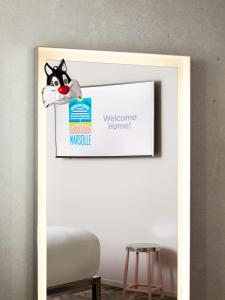 a picture frame with a picture of a cat on it at Mama Shelter Marseille in Marseille