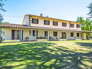 an old house with a large yard in front of it at Villa Villa Beboli per 18 pax by Interhome in Lamporecchio