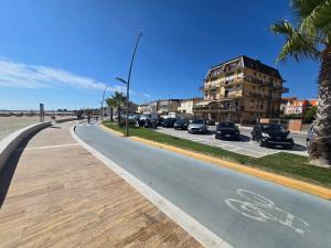 a street with cars parked on the side of the road at Casa al Mare Civitanova Marche in Civitanova Marche