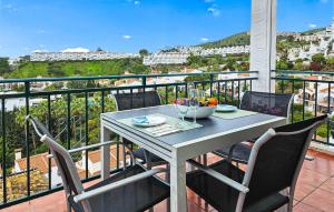 a table and chairs on a balcony with a view at El Mirador De Calahonda in La Cala de Mijas