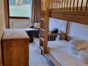 a room with two bunk beds and a desk at Studio divisible, ski aux pieds, vue sur pistes - FR-1-181-2677 in La Plagne Tarentaise