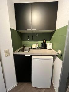 Kuchyň nebo kuchyňský kout v ubytování Citynahes modernes Apartment