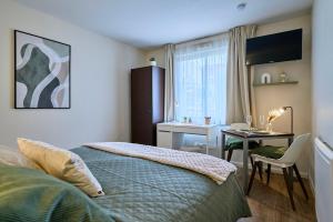 Ένα ή περισσότερα κρεβάτια σε δωμάτιο στο Elegant and cozy Vauban studio