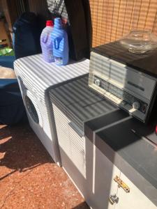 a toaster oven sitting on top of a table at La Primula Vicinanza 5 Terre in Riccò del Golfo di Spezia